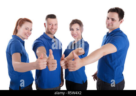 Portrait Of Happy Concierges Showing Thumb Up Sign Banque D'Images