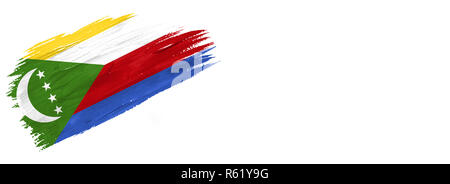 Drapeau peint des brosses. Pavillon style dessiné à la main des Comores isolé sur fond blanc avec place pour le texte. Banque D'Images