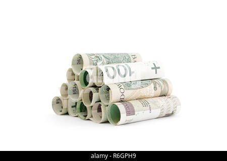 Billets polonais roulé isolé sur fond blanc Banque D'Images