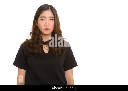 Portrait of young beautiful Asian businesswoman looking at camera Banque D'Images