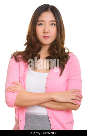 Portrait of young beautiful Asian woman with arms crossed Banque D'Images