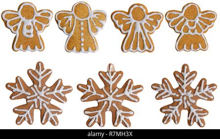 Ensemble de gingerbread cookies en forme de flocons de neige et l'Ange avec le miel et la cannelle isolé sur fond blanc Banque D'Images