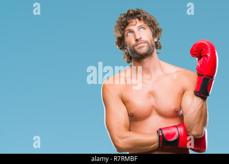 Handsome young man wearing boxing gloves boxer sur fond isolé { cocoartf ansiansicpg1tf12521404cocoasubrtf470 Banque D'Images