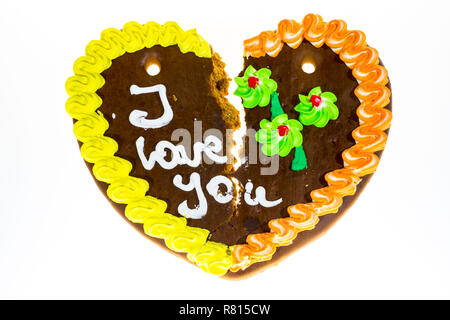 Broken gingerbread heart avec le message "I love you", image symbolique de séparation ou de divorce Banque D'Images