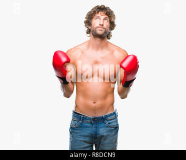 Handsome young man wearing boxing gloves boxer sur fond isolé { cocoartf ansiansicpg1tf12521404cocoasubrtf470 Banque D'Images