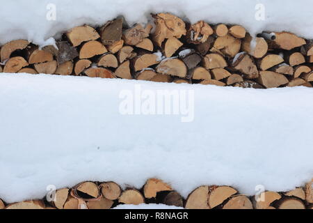 Québec,Canada. Bois de chauffage couverte de neige Banque D'Images