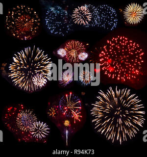 Haut de onze explosion d'artifice, isolé sur fond noir. Fleurs de feu lumineux d'artifice de diverses couleurs et formes dans la nuit Banque D'Images