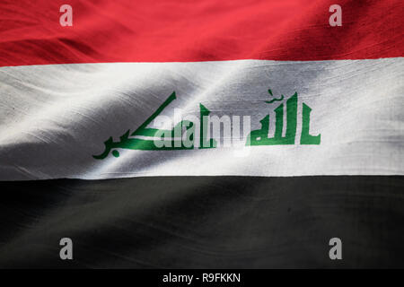 Gros plan du talon et l'Iraq, l'Iraq Drapeau Flag Blowing in Wind Banque D'Images