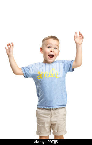 Full Length portrait of cute little kid garçon en vêtement élégant standing against white studio mur. Kids Fashion Concept Banque D'Images