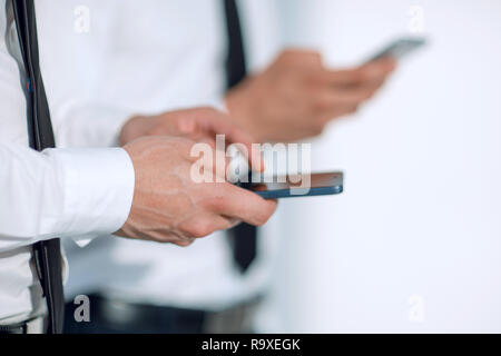 Perdre des téléphones dans les mains Banque D'Images