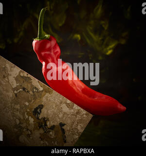 Poivre rouge tuile et culinaire abstrait nature morte photographie Banque D'Images