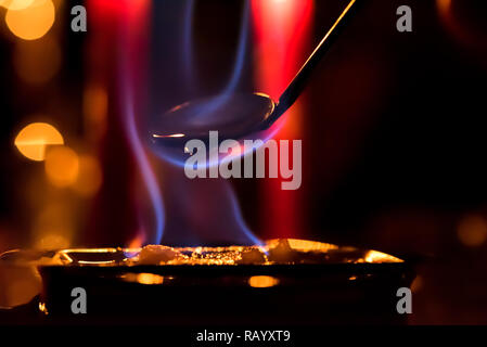 Poinçon gravé : flamme bleue avec fond de couleur fire Banque D'Images