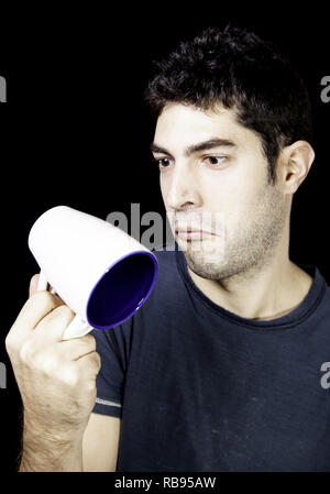 L'homme ayant le petit déjeuner café le matin, des émotions et des gestes Banque D'Images