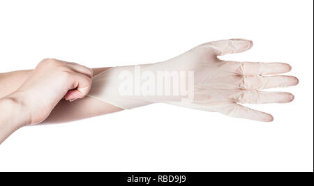 Vue du dessus de la main féminine gants en latex tire sur un autre part isolé sur fond blanc Banque D'Images