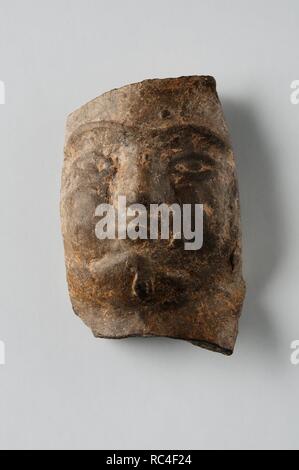 Homme chef de figurine en terre cuite. Hauteur 4, 1 cm Largeur 2.2 cm (1 e - 3 e ) - période romaine de site archéologique de Complutum à Alcalá de Henares ( Madrid ). L'ESPAGNE. Banque D'Images