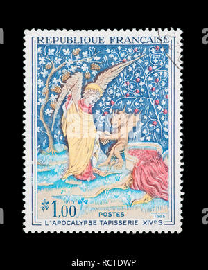 Timbre-poste de la France représentant l'Apocalypse tapisserie du xive siècle pressoir de la Colère de Dieu. Banque D'Images