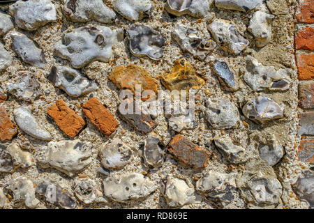 Closeup shot. d'un mur de pierre qui se trouve généralement dans le Sussex. Contexte tourné avec du vrai texture et de belles sonorités. Banque D'Images