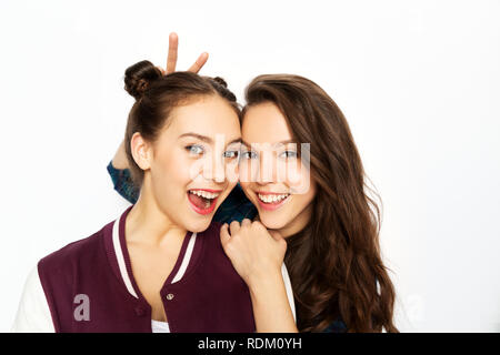 Happy smiling teenage girls over white background Banque D'Images