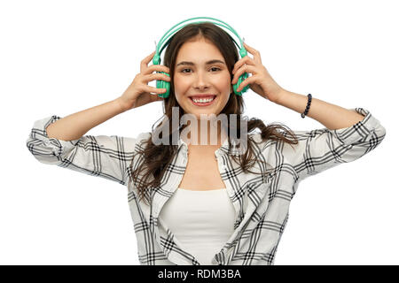 Happy young woman ou teenage girl with headphones Banque D'Images