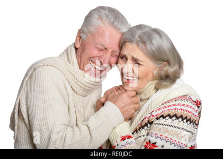 Portrait of smiling mature couple posing against white background Banque D'Images