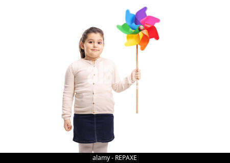 Little girl holding a pinwheel isolé sur fond blanc Banque D'Images