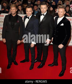 Westlife sont vus sur le tapis rouge lors de la National Television Awards à l'O2, Peninsula Square à Londres. Banque D'Images