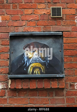 L'homme chien, dogface en casquette, Houldsworth Street, quart nord, Manchester, Angleterre, RU Banque D'Images