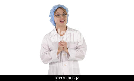 Plan moyen. Femme médecin, professionnel de santé expliquant quelque chose sur fond blanc. Professional tourné en 4K de résolution. 006. Vous pouvez l'utiliser par ex. Banque D'Images