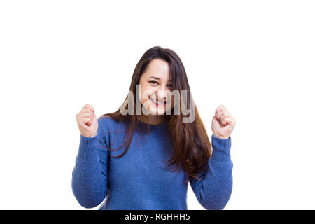 Occasionnels excité young woman holding hands up Célébrons les succès isolated over white background. Banque D'Images