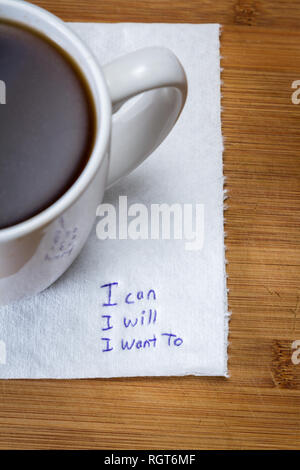 Note manuscrite sur une serviette taché de café avec un message, je peux je vais je veux. Banque D'Images