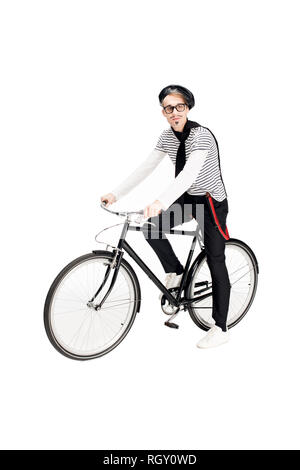 Heureux homme français dans les verres riding bicycle isolated on white Banque D'Images