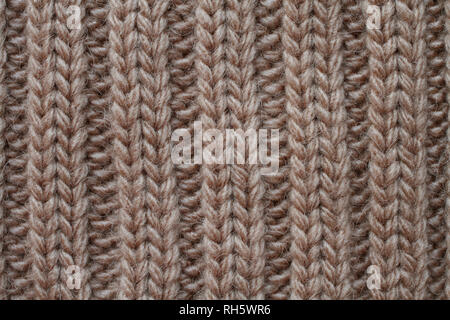 Tricots en laine marron clair la texture. Macro. Banque D'Images
