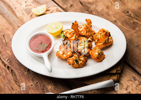 Chou-fleur Rôti / Gobi Tandoori Tikka est une entrée de l'Inde. des aliments servis avec du ketchup. selective focus Banque D'Images