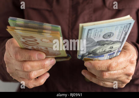 Notes de papier du Canada et USA. Dollar canadien et en Amérique du Nord de l'argent. Vue avant de la vieille femme. projets de manutention. Banque D'Images