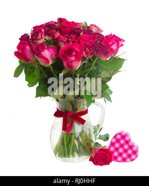 Bouquet de roses rouge foncé en fleurs dans un vase Banque D'Images