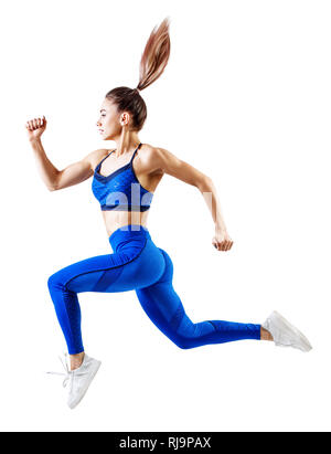 Jeune femme en bleu runner sportswear sauter dans l'air. Banque D'Images