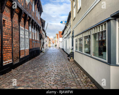 Dans les rues pavées de la ville médiévale Ribe, Danemark Banque D'Images