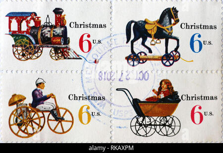 Vieux jouets sur quatre timbres de Noël américains Banque D'Images