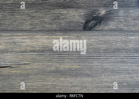 Fond de bois rustique en détresse avec un noeud de couleur gris-brun avec une teinte beige. Banque D'Images