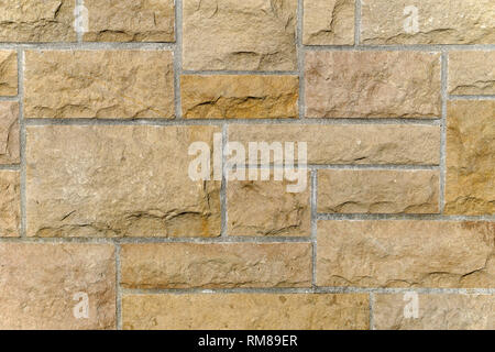 Close-up of a brown modulaire résidentiel mur de pierre Banque D'Images