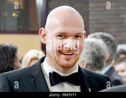 13 février 2019, la Russie, Moscow : Space traveler Alexander Gerst sourit dans l'ambassade allemande à un party de bienvenue. (Dpa : 'Künzelsauer Astro-Alex' pour 'Parti à Moscou avec Annaweech bande' à partir de 14.02.2019) Photo : Ulf Mauder/dpa Banque D'Images