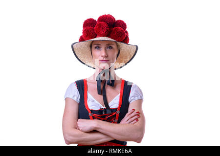 Jolie jeune femme portant une robe traditionnelle de la Forêt-Noire avec une Bollenhut orné de pompons rouges 14 Banque D'Images