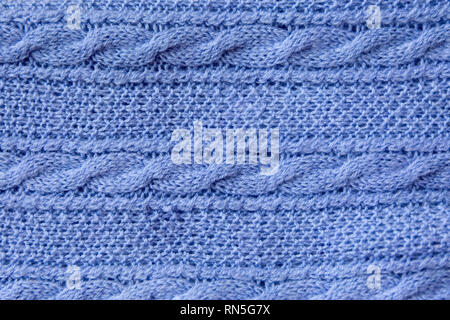 Tissu de laine tricoté bleu texture. Fond d'hiver chaud confortable. Banque D'Images