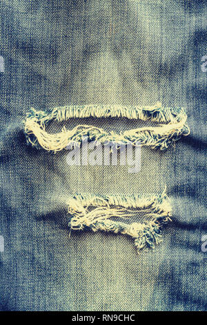 Jeans denim déchiré la texture. Banque D'Images