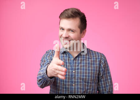 European young man giving hand for handshake Banque D'Images