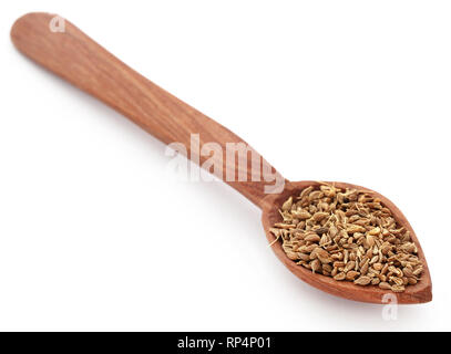 Les graines d'anis dans un scoop sur fond blanc Banque D'Images