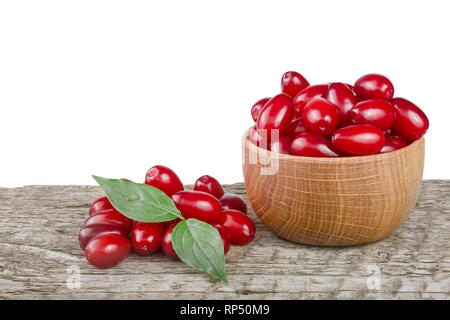 La sésie berry avec la feuille dans un bol sur la table en bois avec un fond blanc. Banque D'Images