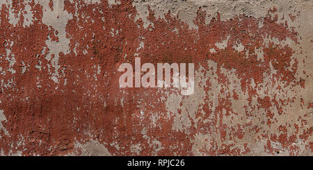 Mur rouge avec fond peinture desséchée. La texture du plâtre ancien. Banque D'Images