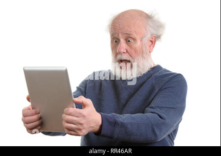 Funny choqué old man using tablet computer isolated on white Banque D'Images