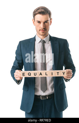 Man in suit holding cubes alphabet avec égalité mot, isolated on white Banque D'Images